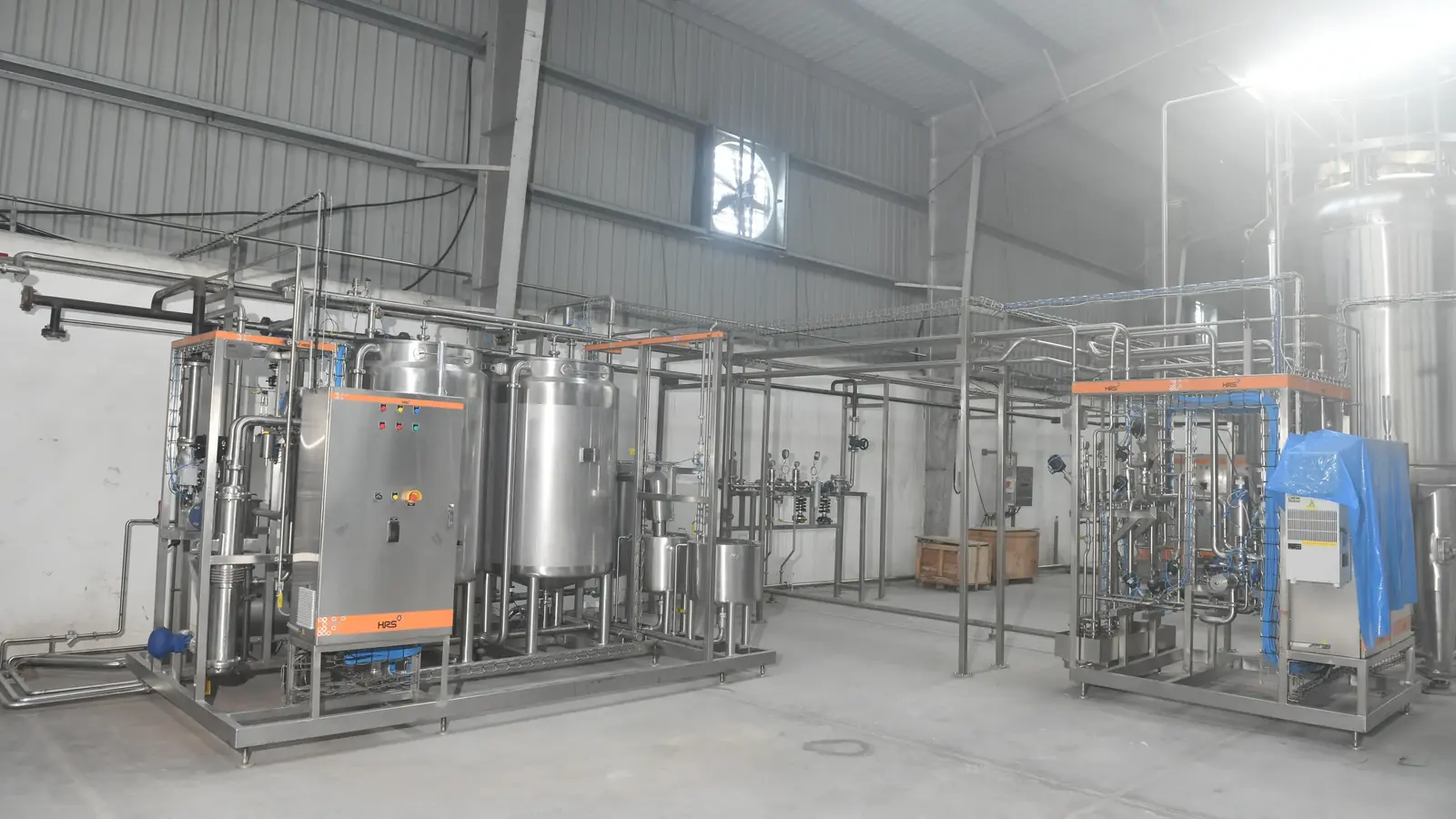 Stainless utility skid beside the CIP-adjacent plant